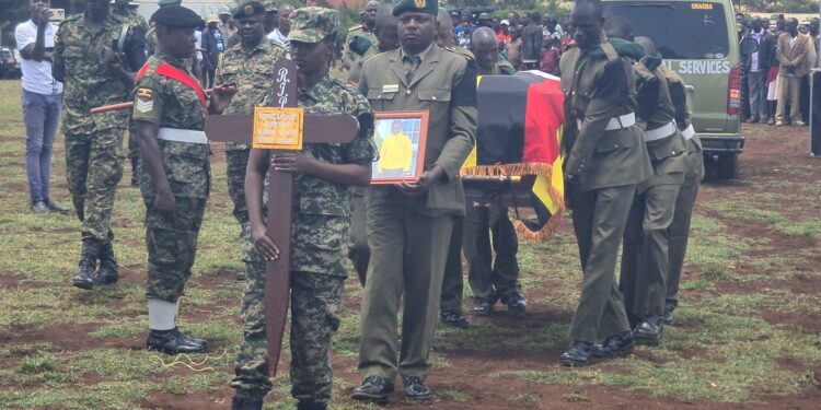 Military Personnel Accords Rebecca Cheptegei a honory tribute during her funeral ceremony at Bukwo, Eastern Uganda