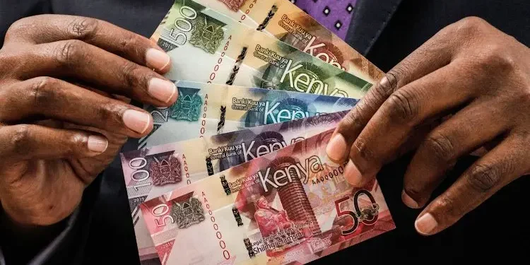 CBK has announced the new changes to the current currency banknotes in circulation. The image is of a man holding Kenya's banknotes in denomination of KES50, KES100, KES200, KES500 AND KES1000.