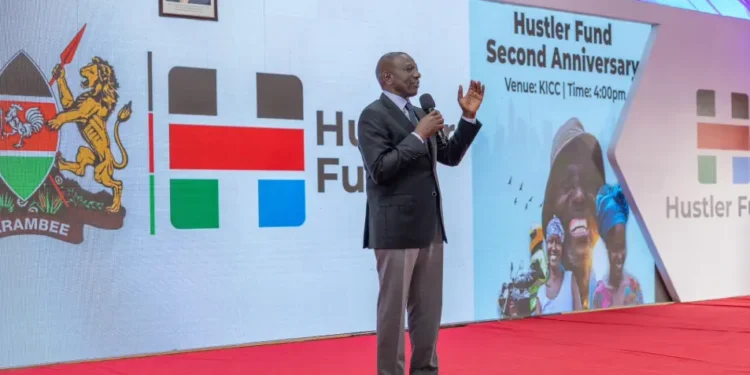 President Ruto speaking during the Hustler Fund's second anniversary at the KICC, Nairobi. He announced new developments to the state-controlled digital lending system.