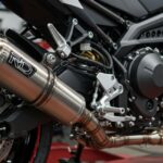 Escapamento RD exhaust system on Yamaha RD motorcycle showing expansion chamber design and performance styl